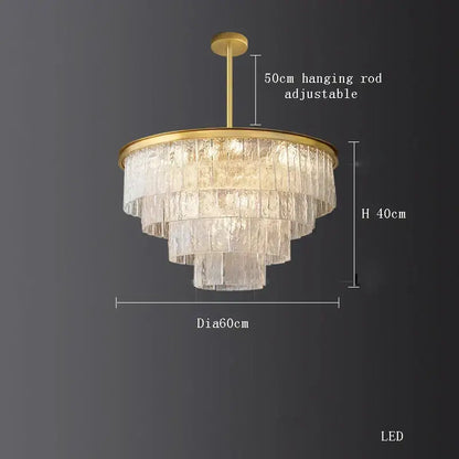 A decorbites crystal led tiered chandelier with clear textured glass shades and gold metal frame for dining room