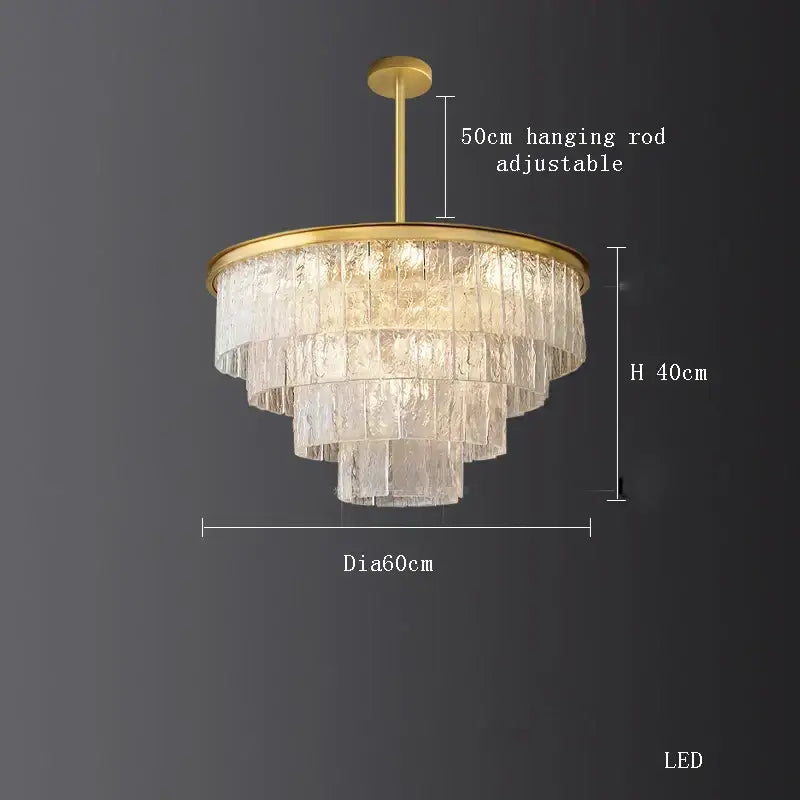 A decorbites crystal led tiered chandelier with clear textured glass shades and gold metal frame for dining room