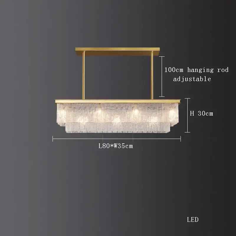 Gold-toned decorbites crystal led rectangular chandelier with cascading textured glass panels for dining room lighting