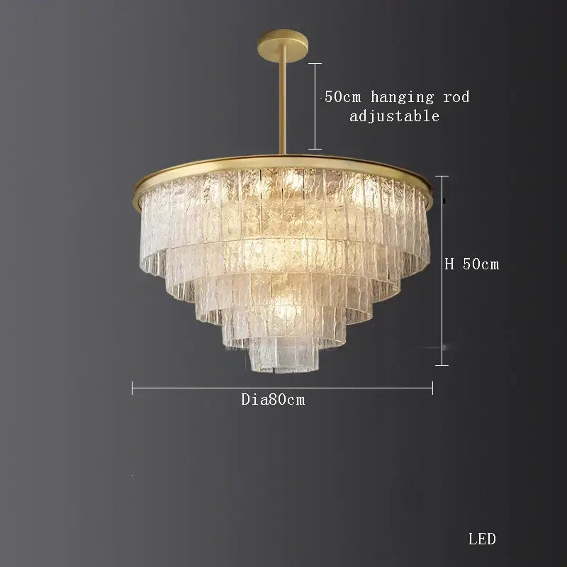 A tiered decorbites crystal led chandelier with brass-finished metal frame and glass panels for dining rooms