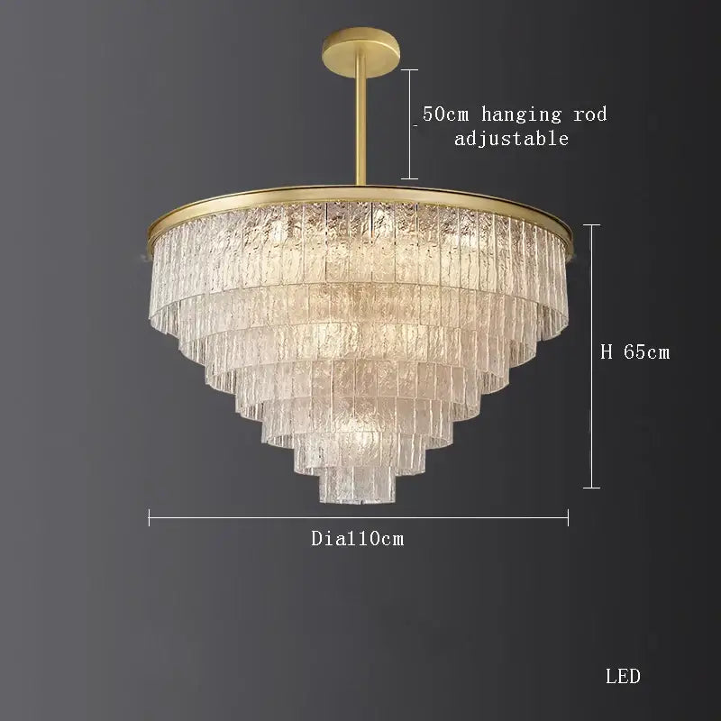 A decorbites crystal led chandelier with gold metal frame and cascading textured glass panels for dining room lighting