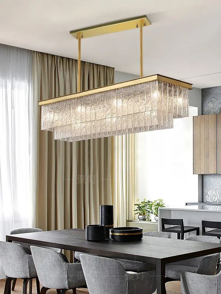 Gold-toned decorbites crystal led chandelier with cascading textured crystal strands for dining room lighting