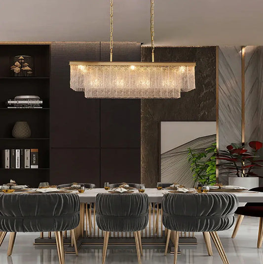 Gold-toned decorbites crystal led chandelier with rectangular frame and cascading crystal fringe for dining room lighting