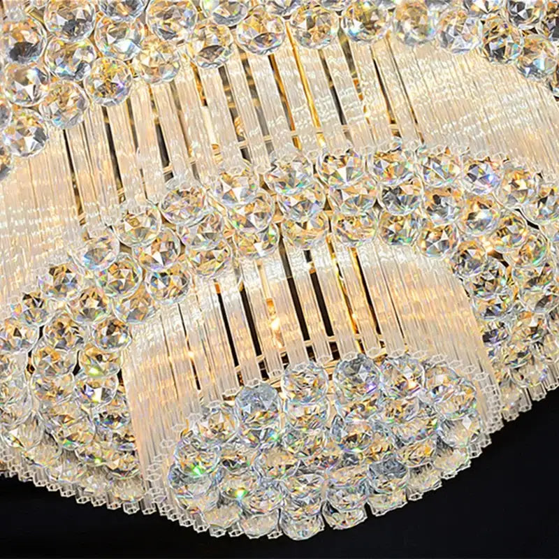 A decorbites crystal led chandelier ceiling lamp with gold accents and cascading clear faceted crystals for living room