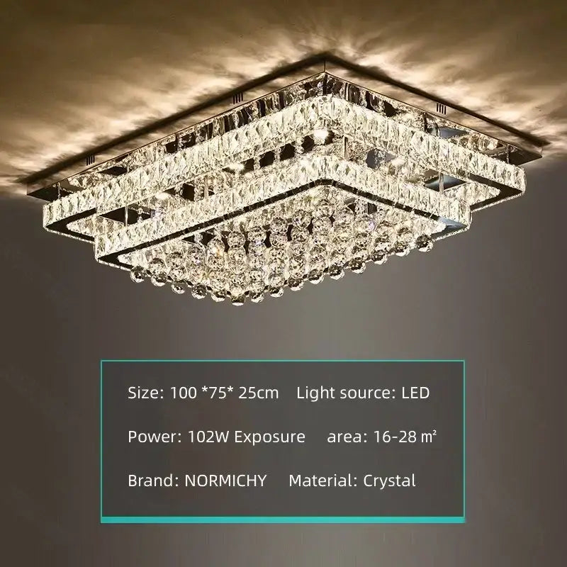 A rectangular decorbites crystal led chandelier with faceted glass crystals and black metal frame for dining rooms