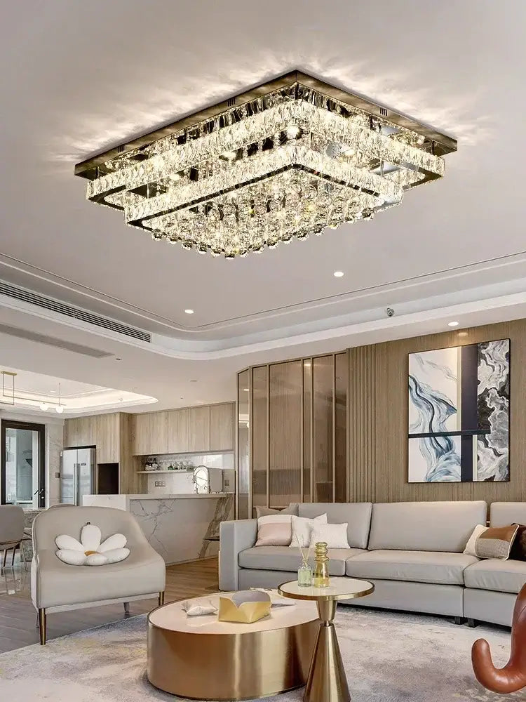 A decorbites crystal led chandelier with silver chrome rectangular frame and multiple hanging crystal tiers for dining room
