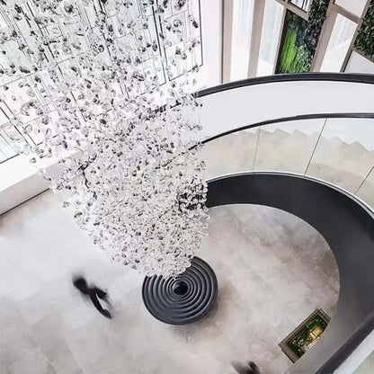 A dazzling decorbites crystal led chandelier with cascading tree-like glass design for luxury staircase lighting