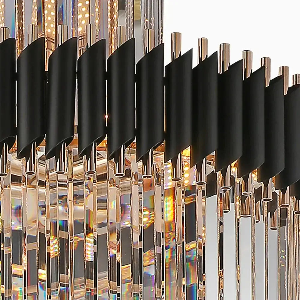Modern chandelier with black matte cylindrical shades and cascading crystal prisms in gold-toned decorbites crystal led frame