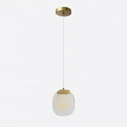 A decorbites crystal led pendant with brushed brass mount and translucent glass shade for warm yellow kitchen lighting
