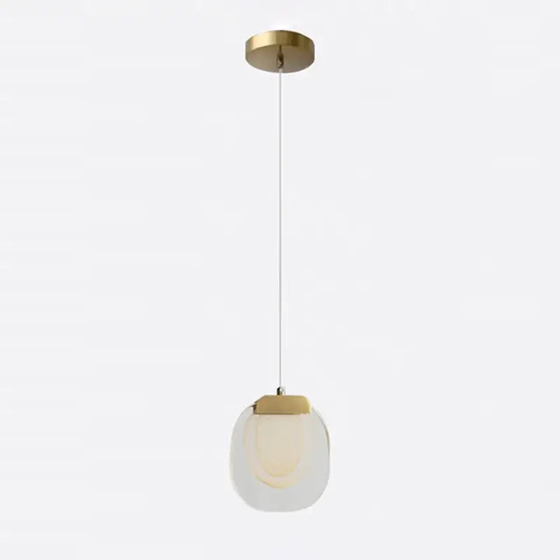 A decorbites crystal led pendant with brushed brass mount and translucent glass shade for warm yellow kitchen lighting