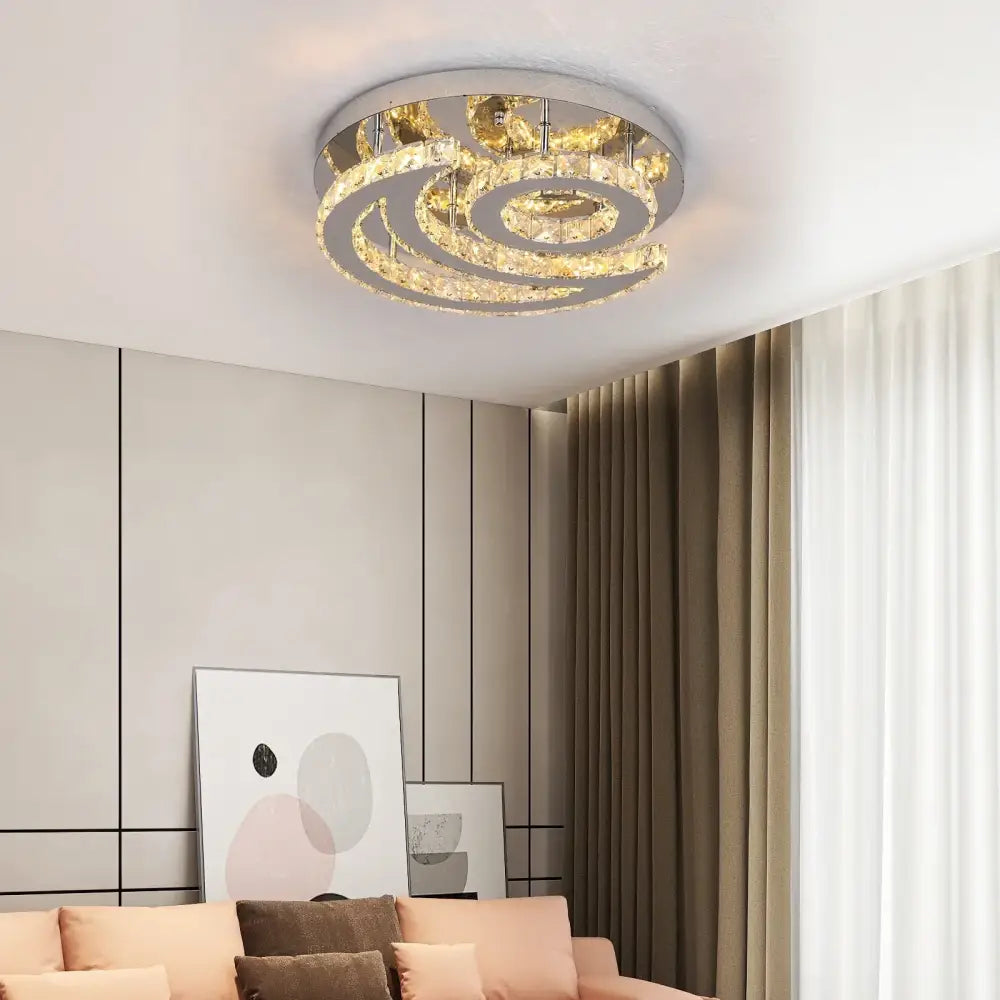 Modern circular decorbites crystal led sun moon spiral chandelier with concentric clear crystal rings and polished chrome finish