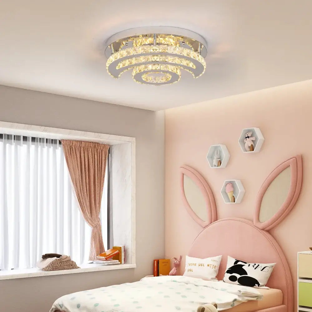 A decorbites crystal led sun moon spiral chandelier with clear crystal rings and polished chrome finish for dining rooms
