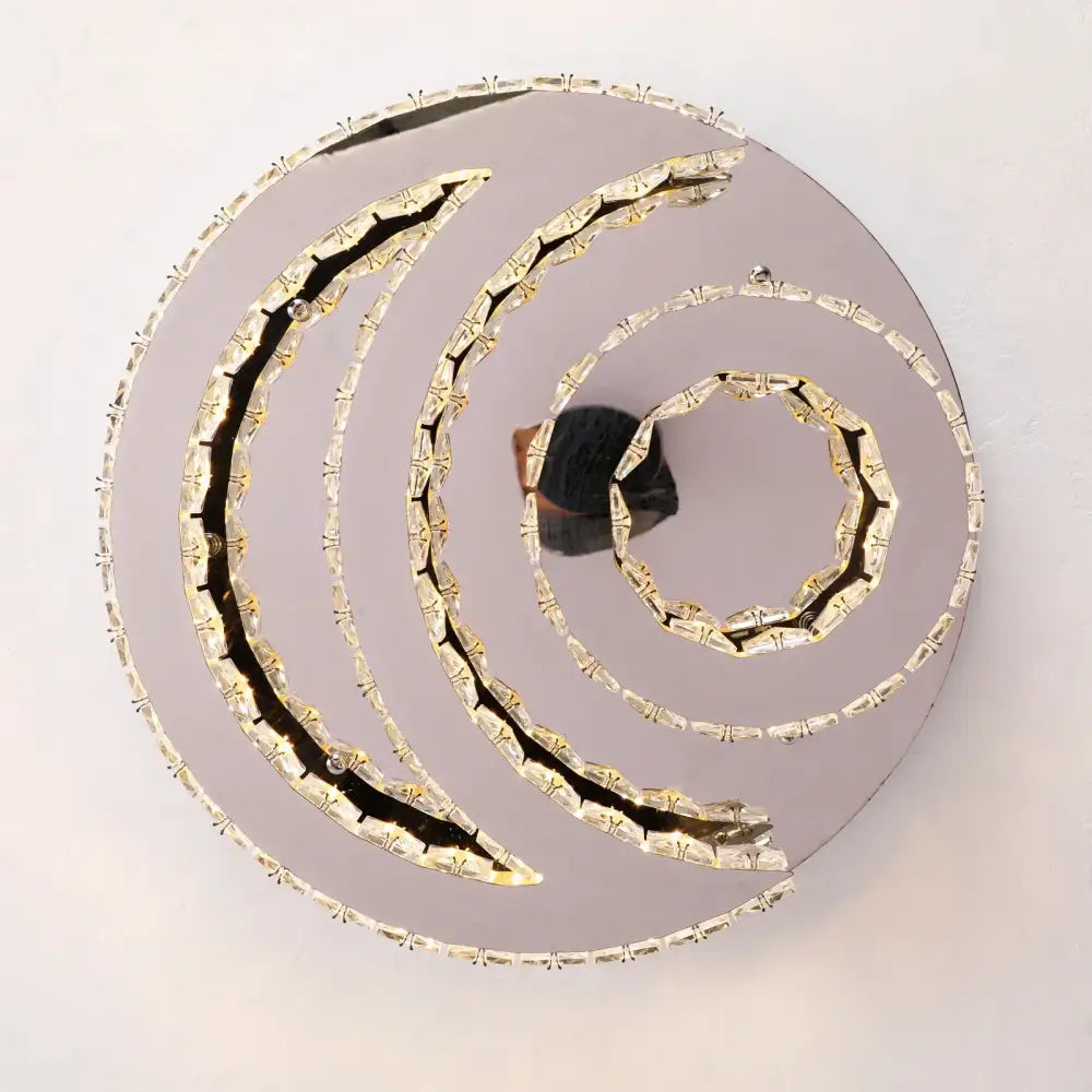 Circular wall-mounted mirror with gold-toned crystal led sun moon spiral patterns from decorbites crystal led chandelier
