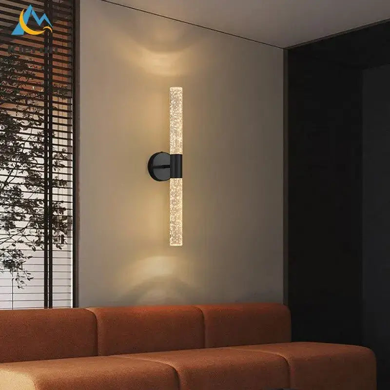 Modern black decorbites crystal led wall lamp with textured translucent glass cylinder emitting warm ambient light