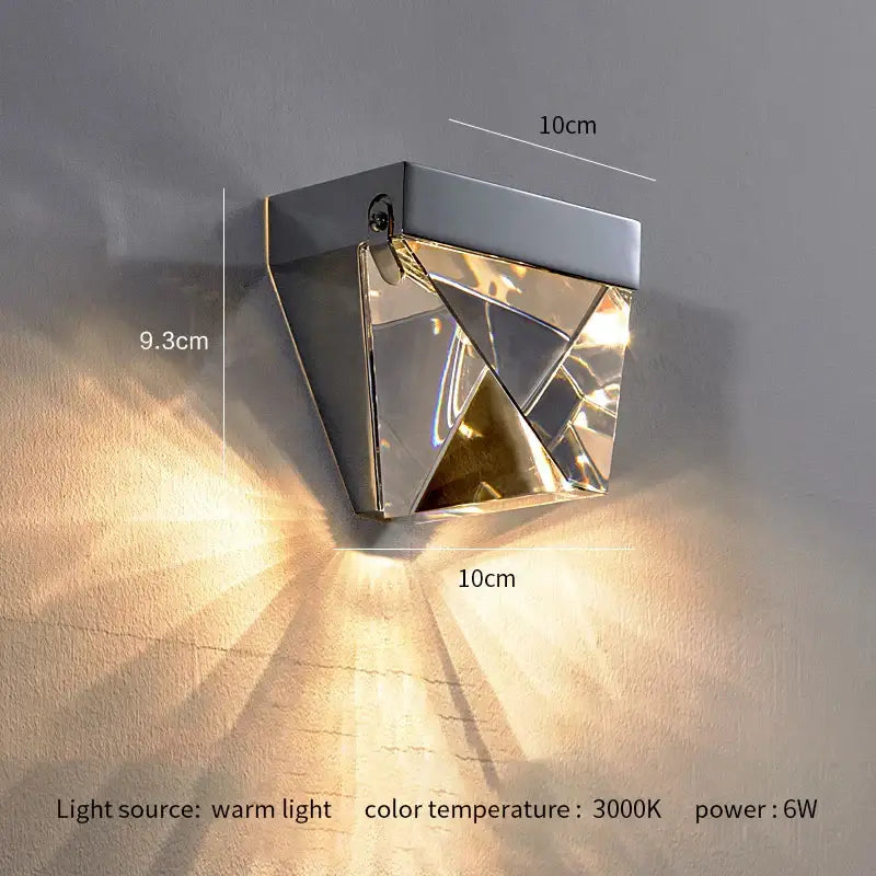 Modern gold crystal led wall sconce with polished chrome faceted panels refracting warm light for bedroom decorbites crystal led wall