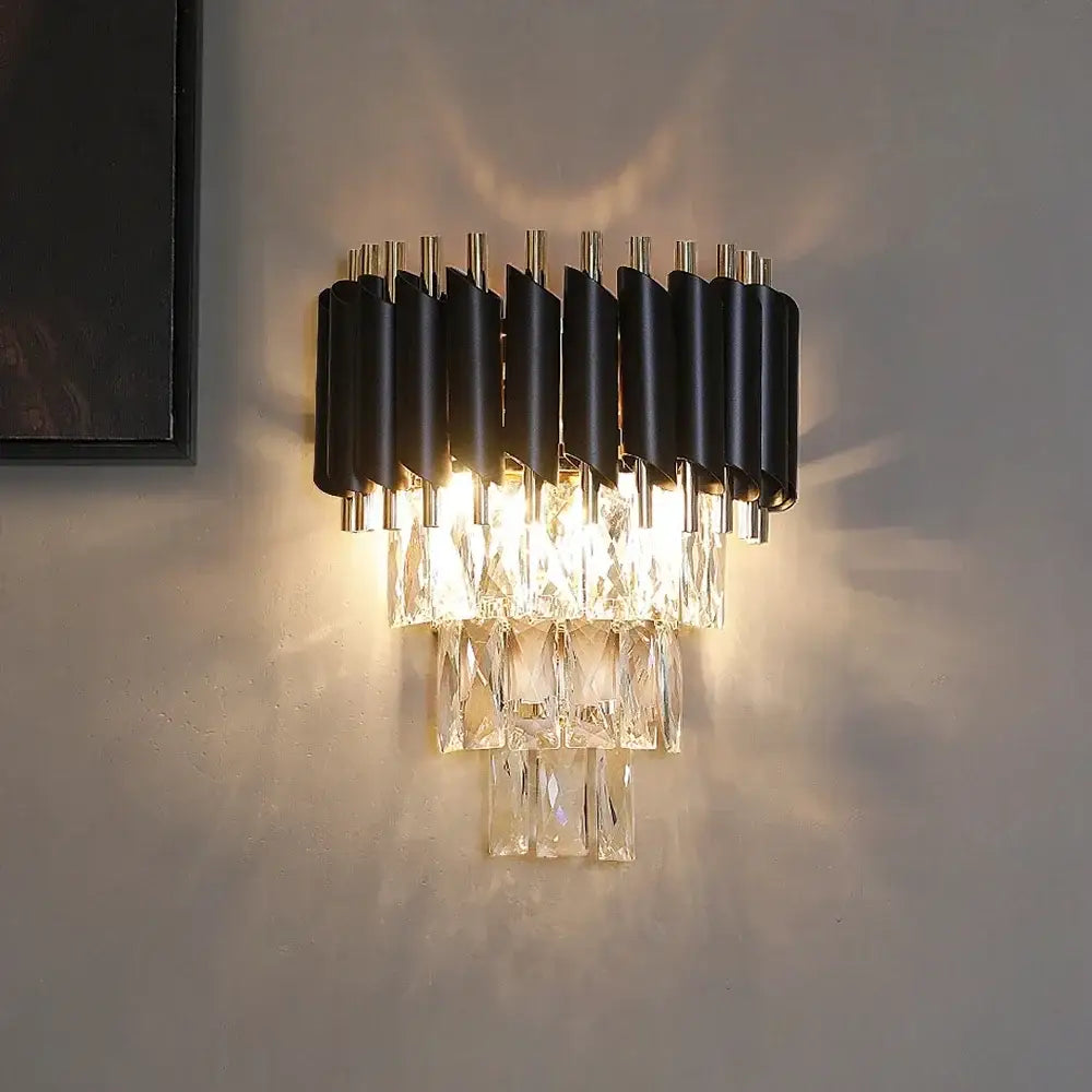 Modern black crystal led wall sconces with tiered faceted glass elements for bedroom lighting