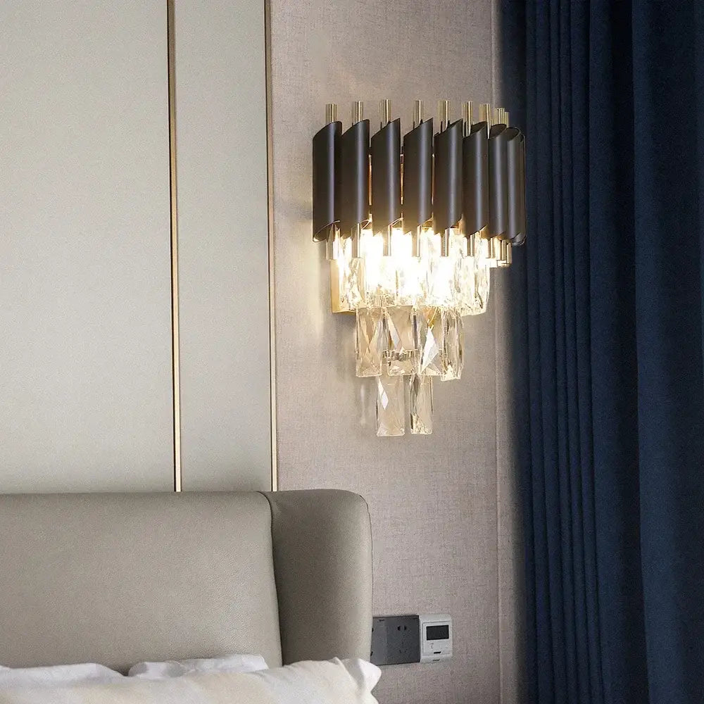 Modern black led wall sconces with sleek metallic frame and cascading clear crystal elements for bedroom lighting