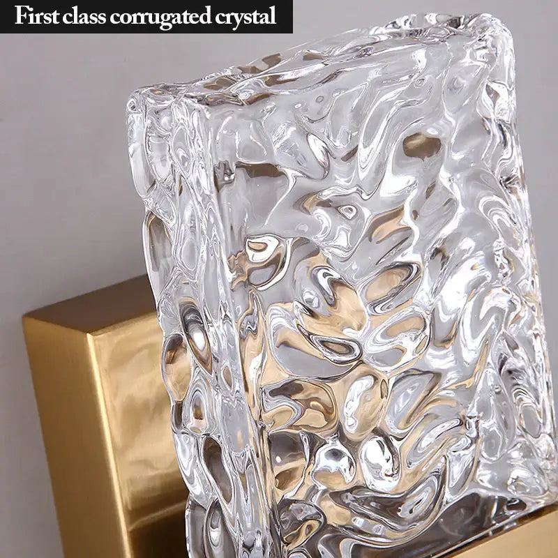 Clear textured glass led wall sconces with wavy bubble surface and gold metallic base for modern bedroom lighting