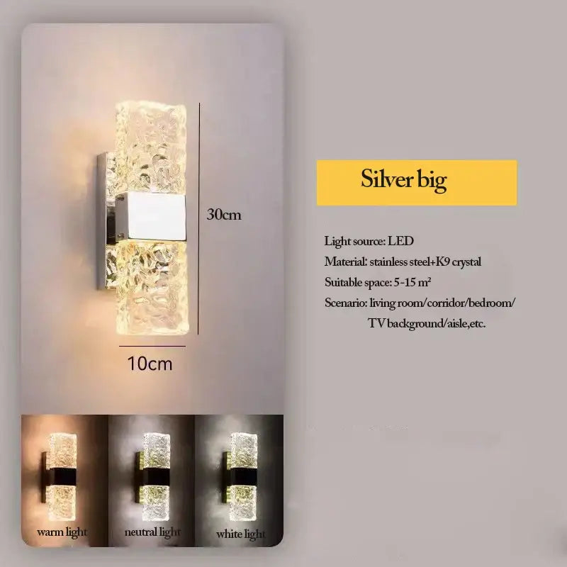 Silver LED wall sconces with textured k9 crystal design and stainless steel accents for modern bedroom lighting