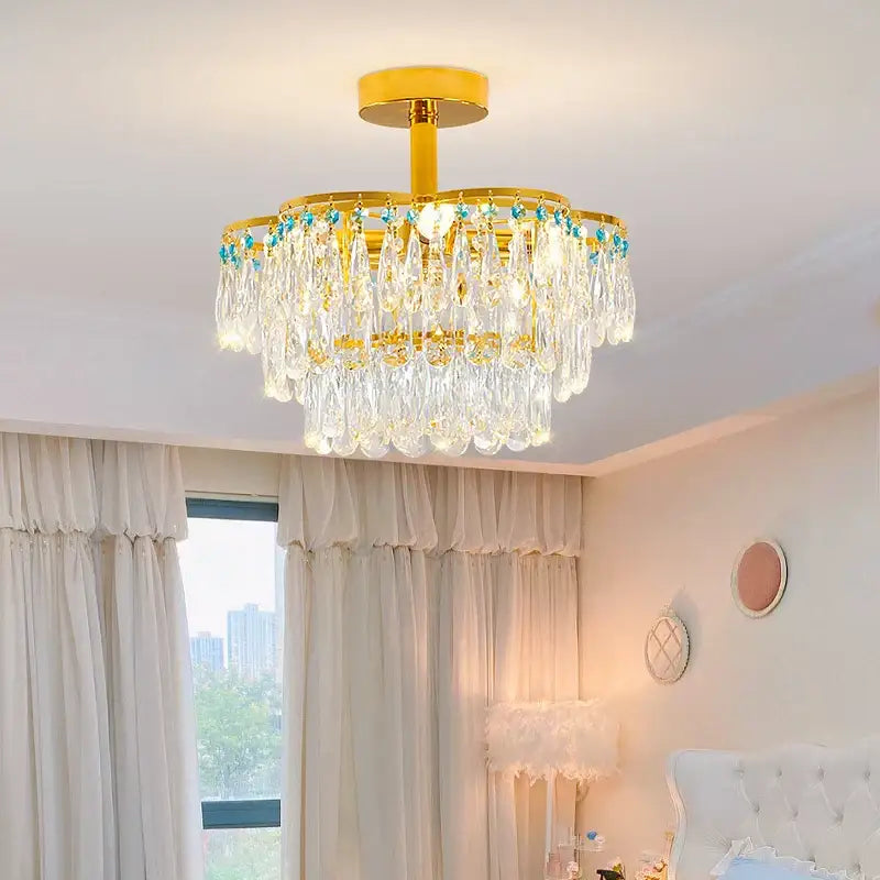 Post-modern gold and turquoise crystal light chandelier with cascading clear crystal droplets for dining room decorbites crystal light
