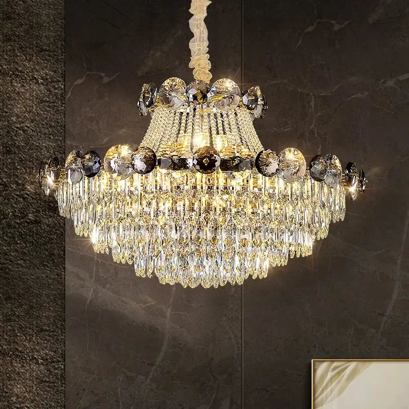 Light luxury chandelier with multi-tiered gold hardware and cascading smoke and clear crystals for dining room