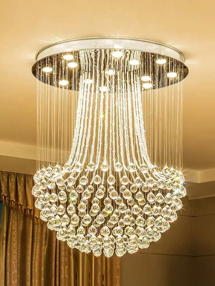 A modern luxury gold crystal light featuring a circular chrome base with cascading clear faceted crystals for decorbites crystal light