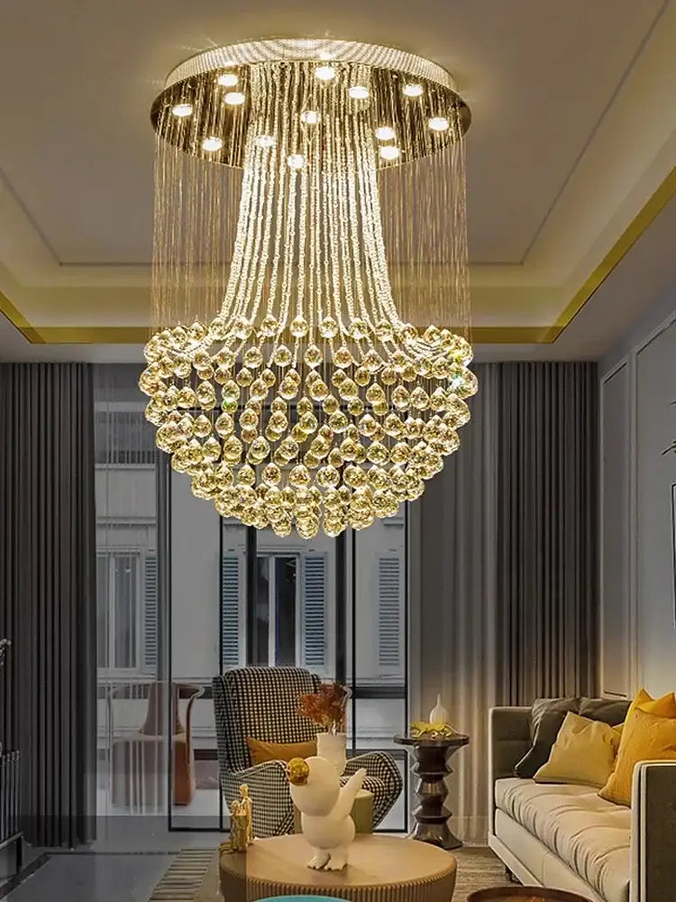 A modern luxury gold crystal light chandelier with cascading teardrop strands for elegant dining room decorbites crystal light