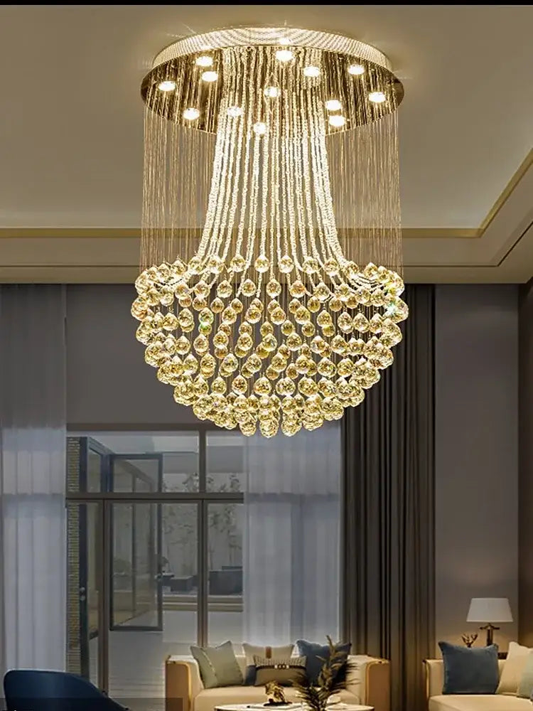 Modern luxury gold crystal light chandelier with cascading teardrop crystals for elegant dining room decorbites crystal light