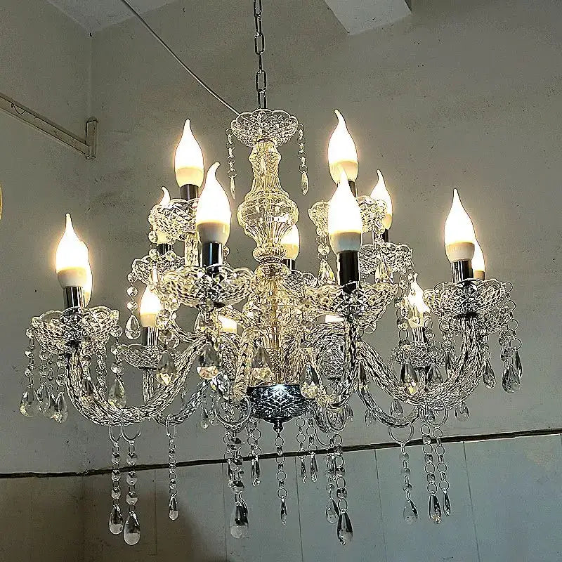 European style crystal light road pendant light with intricate cut glass arms and lit candle-style bulbs for wedding hall decorbites crystal light