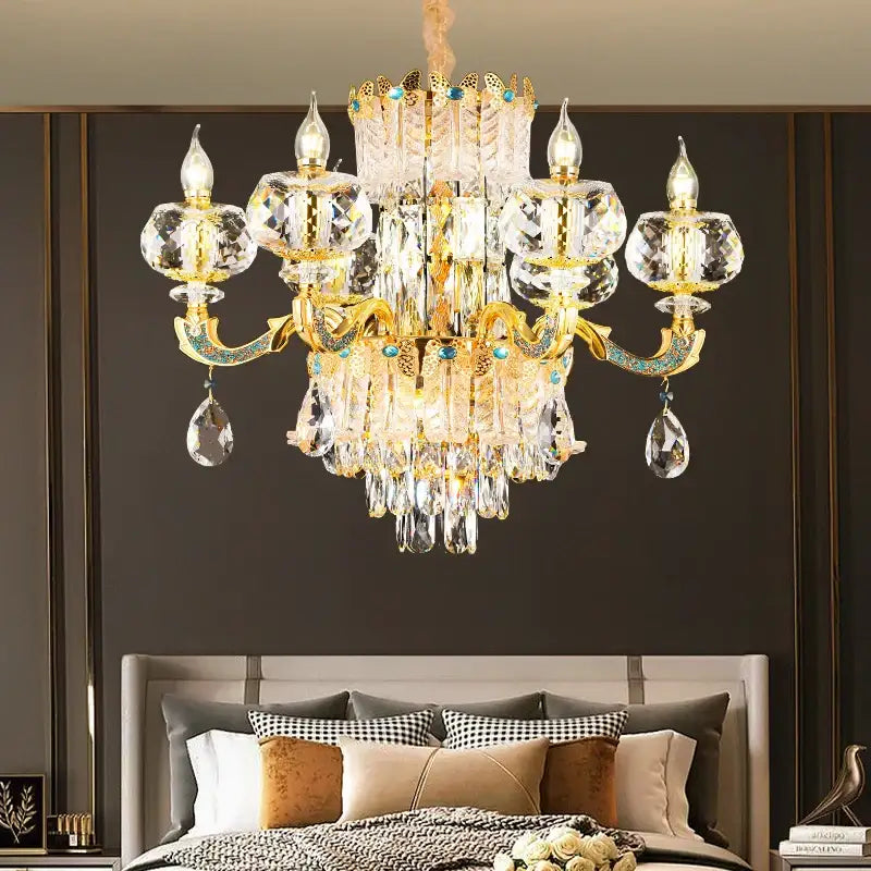Grand multi tier gold crystal chandelier with turquoise accents and intricate detailing for crystal living room decor