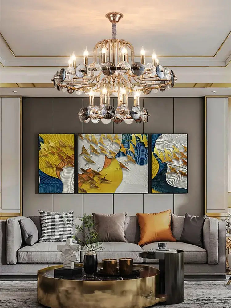 Luxury gold crystal living room chandelier with candle bulbs featuring gold-toned frame and crystal accents lit bulbs decorbites crystal living