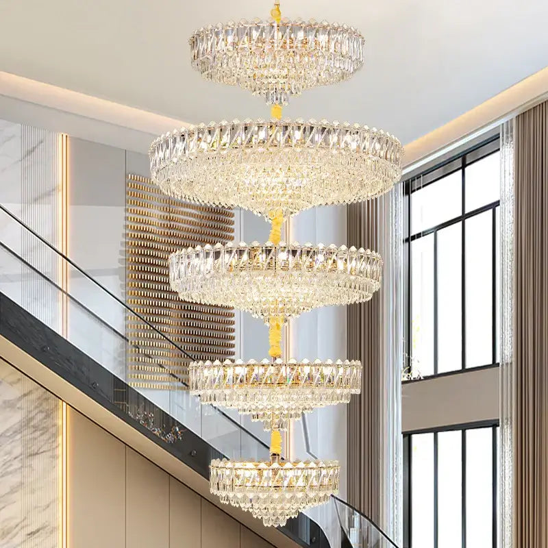 Modern gold multi tiered crystal living room chandelier with a golden frame and cascading clear faceted crystals for decorbites crystal living