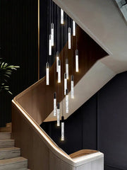 Modern silver and black crystal living room hotel chandelier with sleek pendant lights hanging above staircase decorbites crystal living