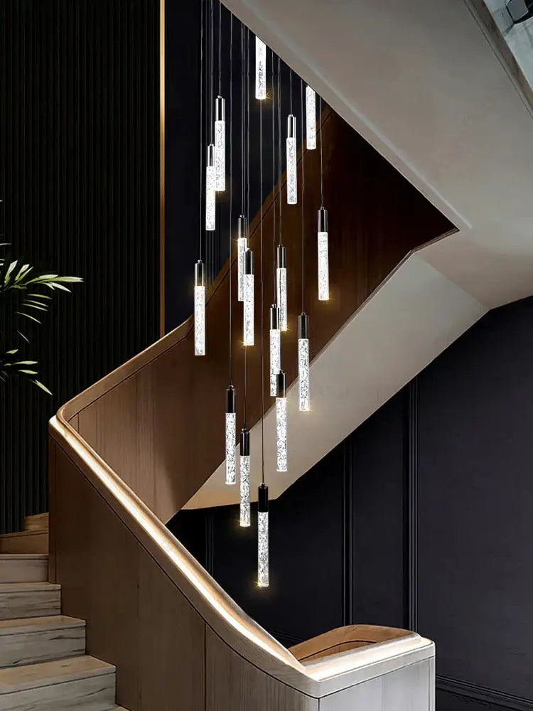 Modern silver and black crystal living room hotel chandelier with sleek pendant lights hanging above staircase decorbites crystal living