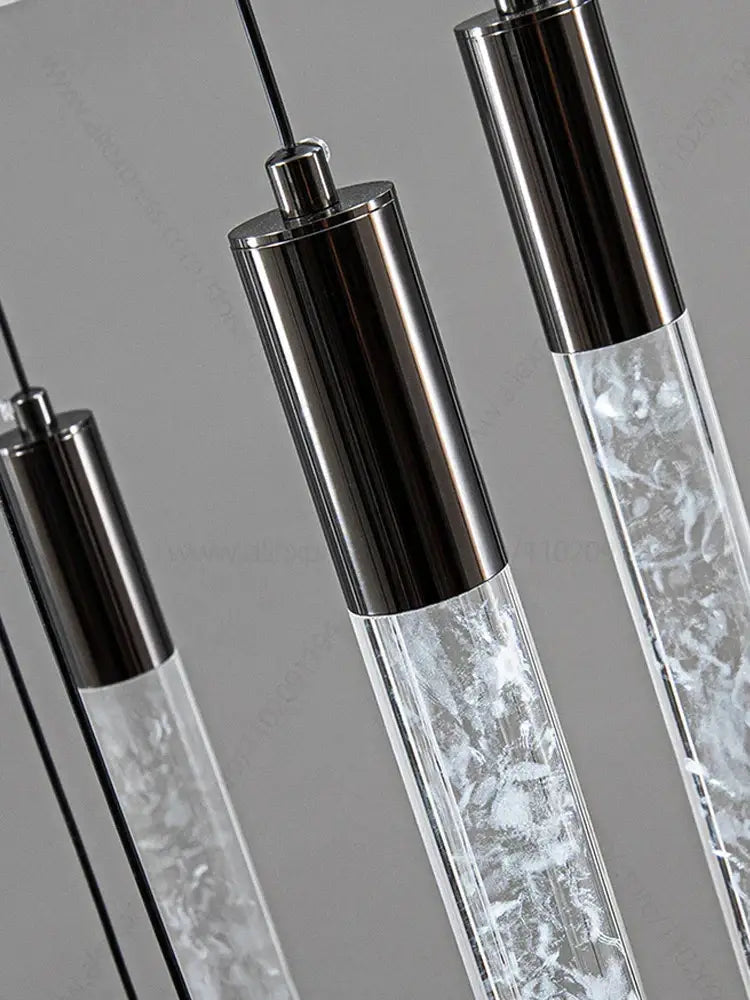 Modern silver and black crystal living room hotel chandelier with cylindrical pendant lights featuring swirling white patterns