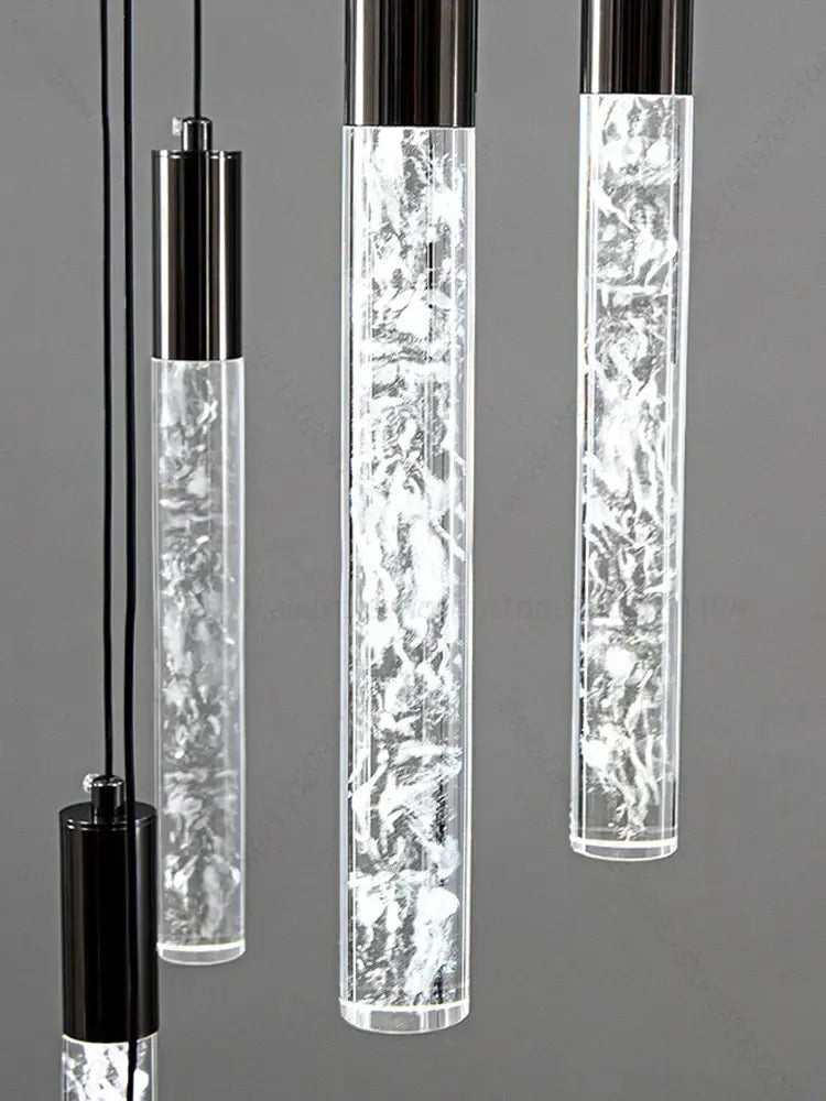 Modern silver and black crystal living room hotel chandelier with cylindrical pendant lights featuring textured glass and glowing elements
