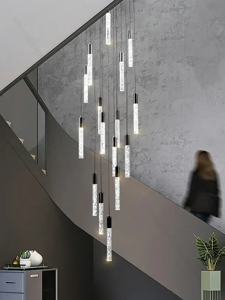Modern silver and black crystal living room hotel chandelier with cascading translucent textured glass cylinders and metal accents