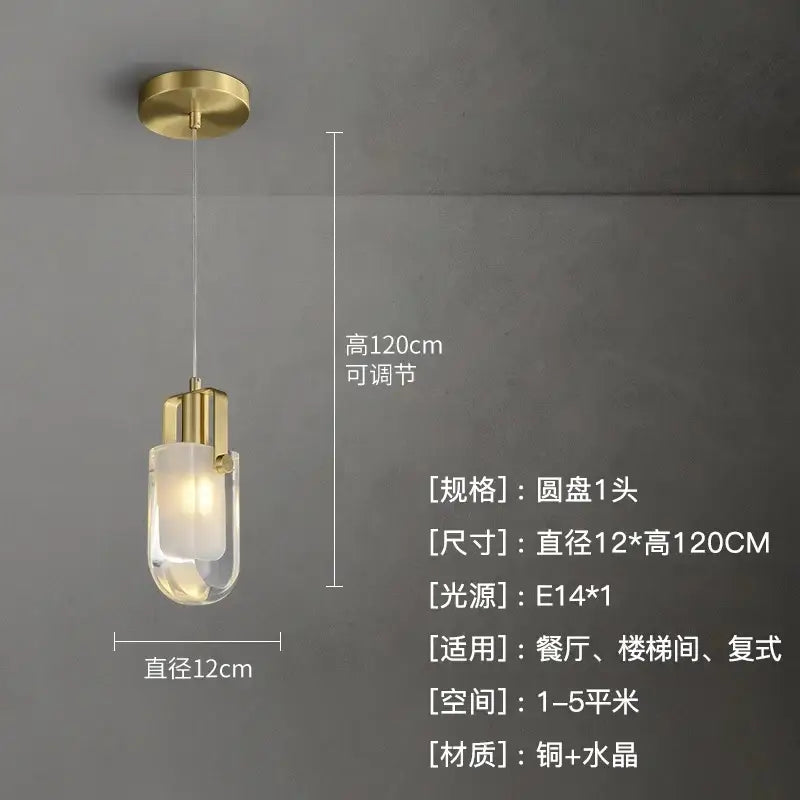 Modern gold cascading crystal loft chandelier with brass fixture and clear glass shade providing warm illumination