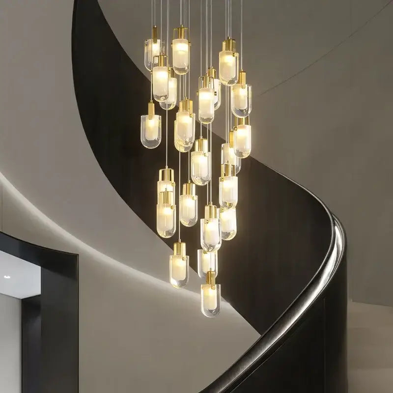 Modern gold cascading crystal loft chandelier with clear glass pendant lights for elegant living room lighting