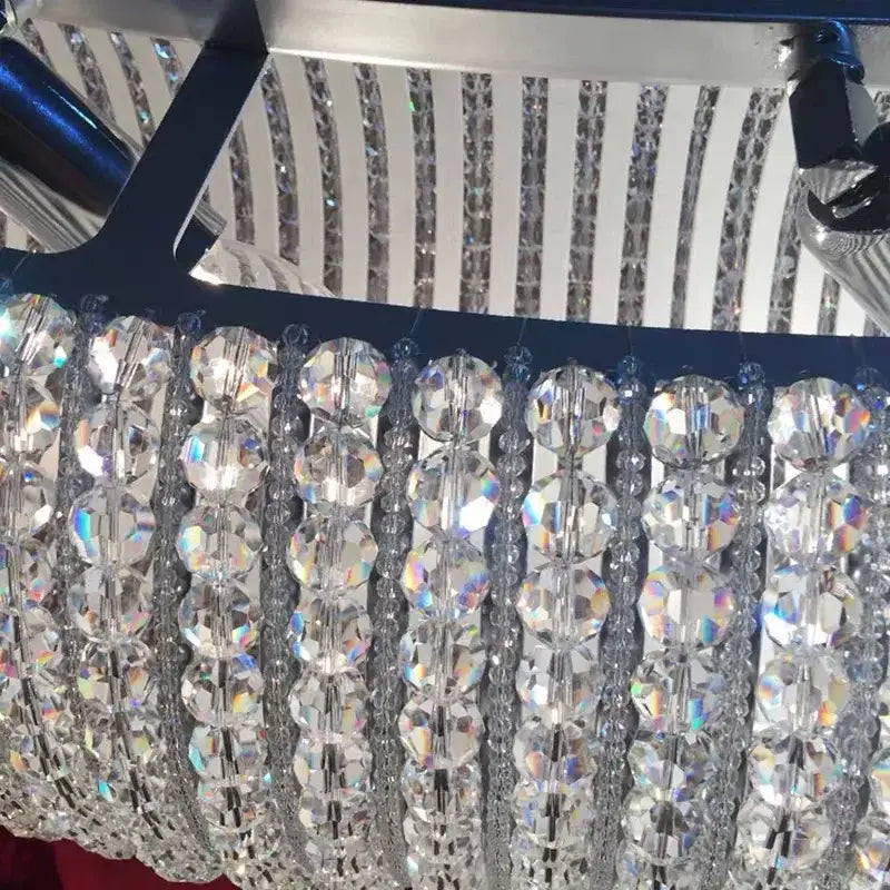 A modern luxury crystal loft chandelier with clear faceted beads in a cascading pattern for living room decorbites