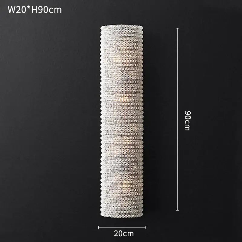 A modern luxury crystal loft chandelier wall sconce with clear faceted beads in a cylindrical design for living room decorbites crystal loft