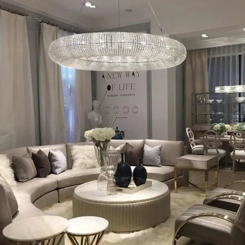 A large circular modern luxury crystal loft chandelier with sparkling crystal design for living room decor