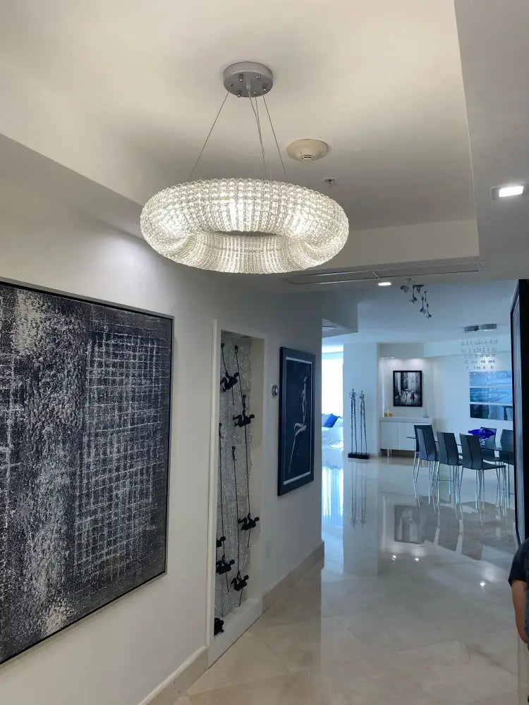 Modern crystal loft chandelier with circular crystal-encrusted design and silver metallic base for living room decorbites crystal loft