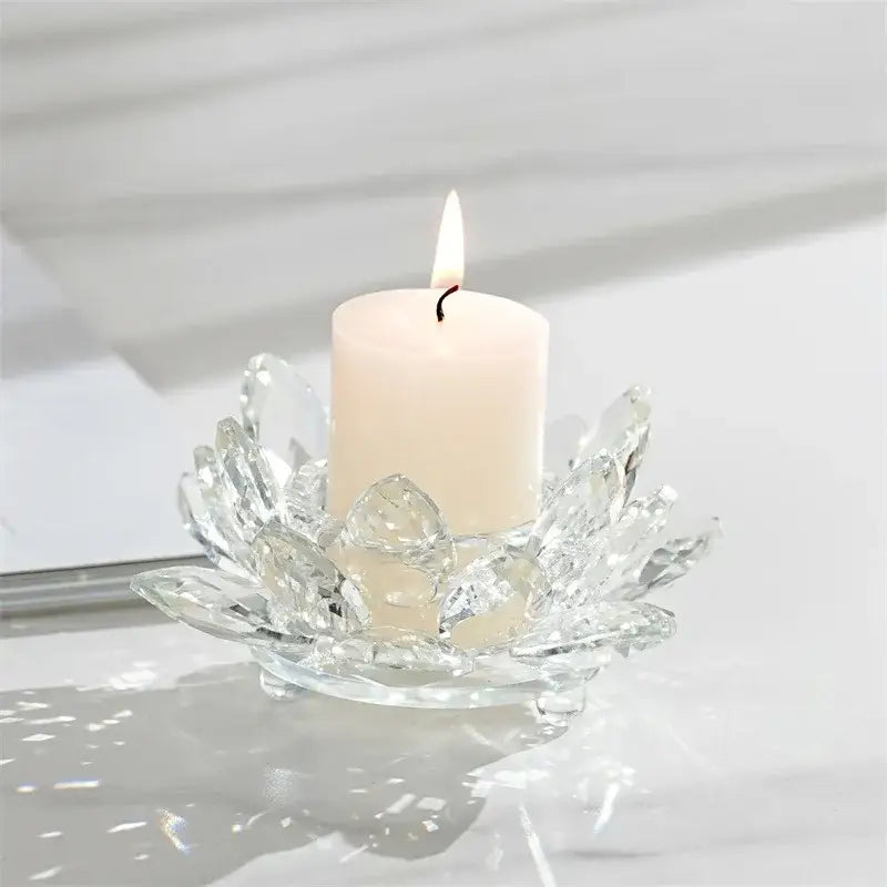 Clear crystal lotus candle holder with a white pillar candle for colorful dining room aromatherapy use