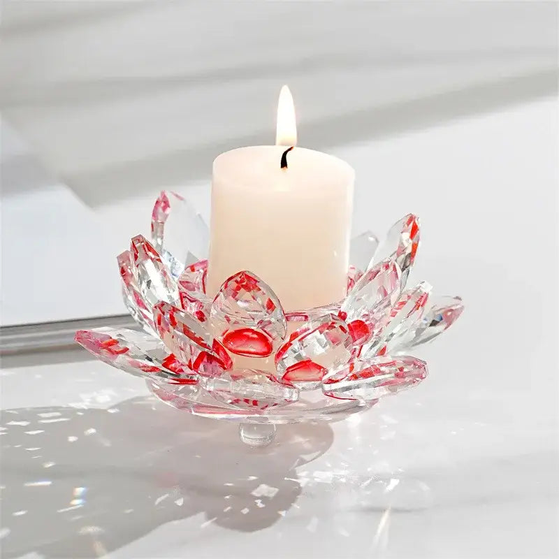 Clear crystal lotus candle holder with red accents designed as a colorful aromatherapy dining room base