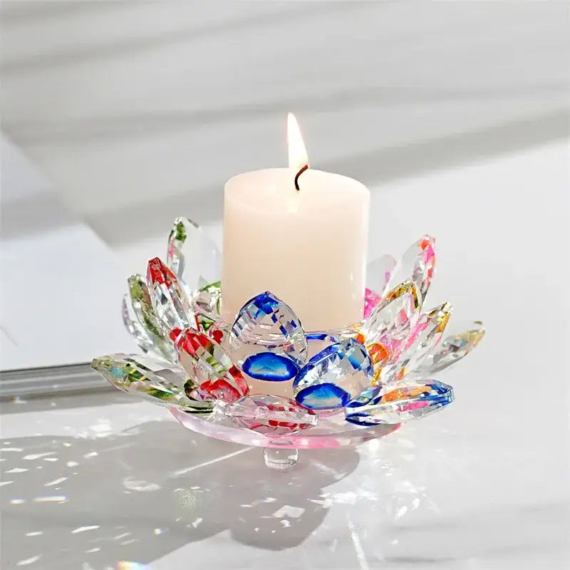A translucent crystal lotus candle holder with colorful red blue and green faceted petals for dining room aromatherapy