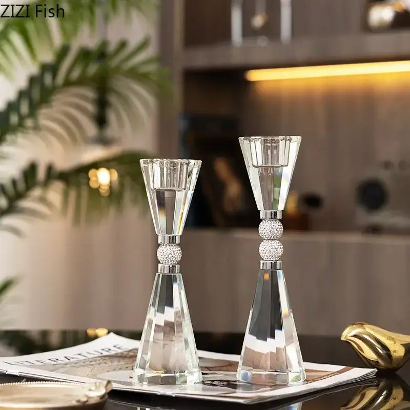 Elegant gold and crystal lotus candle holder set features clear faceted crystal holders with silver rhinestone accents