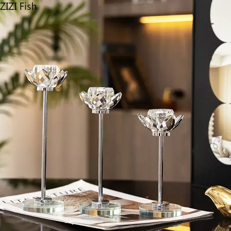 Elegant gold and crystal lotus candle holder set featuring three crystal lotus candle holders with silver stems and glass bases