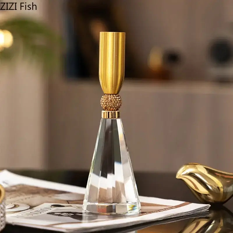Elegant gold and crystal lotus candle holder with faceted base and beaded accent for dining room decor