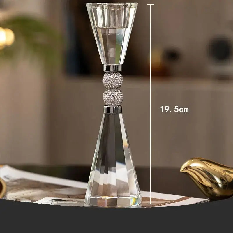 Elegant gold and crystal lotus candle holder featuring a clear faceted design with rhinestone spheres for dining decor
